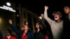 People outside the Justice Palace in Istanbul shout slogans after a Turkish court sentenced philanthropist Osman Kavala to life in prison, April 25, 2022