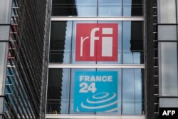 FILE - Radio France Internationale and France 24 logos are seen in this April 9, 2019 file photo.