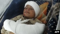 FILE - A wounded child injured in an explosion at Imam Sahib district, north of Kunduz city, receives treatment at a hospital in Kunduz province on April 22, 2022.