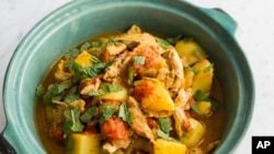 This image released by Milk Street shows a recipe for Cape Malay Chicken Curry. (Milk Street via AP)