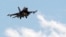 FILE - A Turkish F-16 fighter jet approaches Incirlik Air Base in Adana, Turkey, July 3, 2012. Greece has blocked Turkey from joining an upcoming NATO exercise because of what Athens says is a record number of airspace violations by armed Turkish jets.