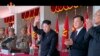 FILE - North Korean leader Kim Jong Un, center, and Liu Yunshan, China's Communist Party's No. 5 leader, second right, waves during a ceremony to mark the 70th anniversary of the country's ruling party, in Pyongyang, Oct. 10, 2015.