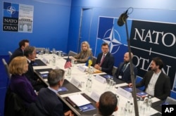 U.S. Secretary of State Antony Blinken meets with Ukraine's Foreign Minister Dmytro Kuleba during the NATO foreign ministers meeting in Bucharest, Romania, Nov. 30, 2022.