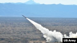 FILE - US soldiers fire a Patriot Missile during training at McGregor Range Complex in New Mexico, Dec. 14, 2014.
