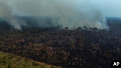 FILE - Smoke rises from a forest fire in the Transamazonica highway region, in the municipality of Labrea, Amazonas state, Brazil, Sept. 17, 2022. (AP Photo/Edmar Barros, File)