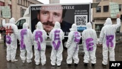 Protesters wear clothes reading 'Free Olivier' during a solidarity demonstration calling for the release from Iranian custody of Belgian aid worker Olivier Vandecasteele, in Brussels, Belgium, Dec. 25, 2022. 