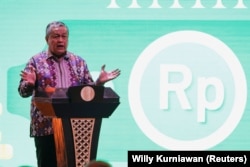 Gubernur Bank Indonesia Perry Warjiyo berbicara dalam pertemuan tahunan dengan pemangku kepentingan keuangan di Jakarta, 30 November 2022. (Foto: REUTERS/Willy Kurniawan)