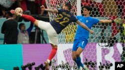 Theo Hernandez scores France's opening goal during the World Cup semifinal soccer match against Morocco in Al Khor, Qatar, Dec. 14, 2022.