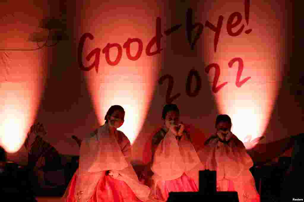 Buddhist faithful celebrate New Year's eve at a temple in Seoul, South Korea, Jan. 1, 2023. 