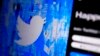 FILE - The Twitter splash page is seen on a digital device, April 25, 2022, in San Diego. European Union data show that Twitter took longer to review hateful content and removed less of it in 2022 compared with the previous year. 