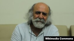 Iranian journalist Keyvan Samimi is seen in a photo by Hosseinronaghi. (Wikimedia Commons) Samimi has been arrested again barely three months after his release from prison following two years of incarceration, his family said on April 25, 2023.