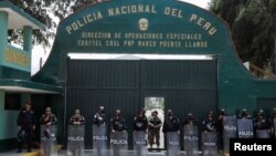 FILE - Police stand guard outside the prison where ousted Peruvian leader Pedro Castillo is being held, in Lima, Peru, Dec. 9, 2022. 