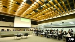 Defendants, lawyers and court attend the opening of the trial against those accused of taking part in the March 2016 suicide bombings, at the Justitia building in Brussels on Nov. 30, 2022.