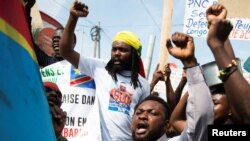 Congolese residents chant as they protest the deployment of a regional force which they see as ineffective in tackling the resurgent rebel group in North Kivu following renewed tensions around Goma in the North Kivu province of the Democratic Republic of Congo.