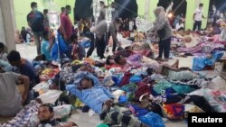 ជនភៀសខ្លួនរ៉ូហ៊ីងយ៉ាទទួលការព្យាបាល ពេលបានធ្វើដំណើរទៅដល់ភូមិ Meunasah Ujong Pie ក្នុងស្រុក Pidie ខេត្ត Aceh ប្រទេសឥណ្ឌូណេស៊ី កាលពីថ្ងៃទី ២៦ ខែធ្នូ ឆ្នាំ ២០២២។