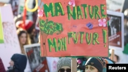 FILE - People take part in a march during the opening of COP15, the two-week U.N. Biodiversity summit in Montreal, Quebec, Canada, Dec. 10, 2022. 