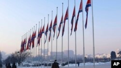 National flags are seen half-staffed on the occasion of the 11th anniversary of the death of Chairman Kim Jong Il in Pyongyang, North Korea, on Dec. 17, 2022. 