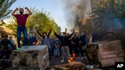 FILE - In this photo taken by an individual not employed by the Associated Press and obtained by the AP outside Iran, Iranians protests the death of 22-year-old Mahsa Amini after she was detained by the morality police, in Tehran, Oct. 27, 2022. 