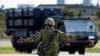 FILE - A member of the Japan Ground Self-Defense Force (JGSDF) conducts a military drill with an anti-ship missiles unit, at JGSDF Miyako camp on Miyako Island, Okinawa prefecture, Japan, Apr. 21, 2022. 
