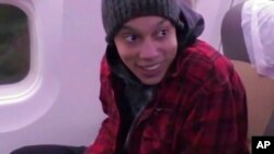 FILE - In this image made from video provided by Russian Federal Security Service, WNBA star Brittney Griner sits in the plane as she flies to Abu Dhabi to be exchanged for Russian citizen Viktor Bout, in Russia, Dec. 9, 2022.