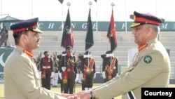 Pakistan's outgoing army chief General Qamar Javed Bajwa, right, handed over the symbolic baton to his successor, General Asim Munir, at a ceremony at the general headquarters in Rawalpindi, Nov. 29, 2022. (Photo courtesy of Inter Services Public Relations)