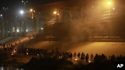 Migrants wait near the U.S.-Mexico border in Ciudad Juarez, Mexico, Dec. 19, 2022.