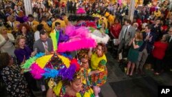 The Baby Dolls make an entrance during the King's Day celebration while kicking-off the official start of 2023 Carnival Season in New Orleans, Jan. 6, 2023.