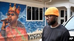 Ugandan singer Eddy Kenzo is seen outside his studio in the Makindye area of the capital Kampala, Uganda, Nov. 18, 2022. Kenzo became the first Uganda-based singer to earn a Grammy nomination. (AP Photo/Hajarah