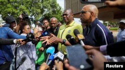 Members of the African National Congress address the media after the ANC National Executive Committee meeting in Johannesburg, South Africa, Dec. 2, 2022. 