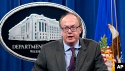 FILE - Jeffrey Clark, then-Assistant Attorney General, speaks during a news conference at the Justice Department in Washington, Sept. 14, 2020. 