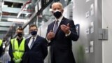 U.S. President Joe Biden speaks as he tours a Pfizer manufacturing plant producing the coronavirus disease (COVID-19) vaccine in Kalamazoo, Michigan, Feb. 19, 2021.