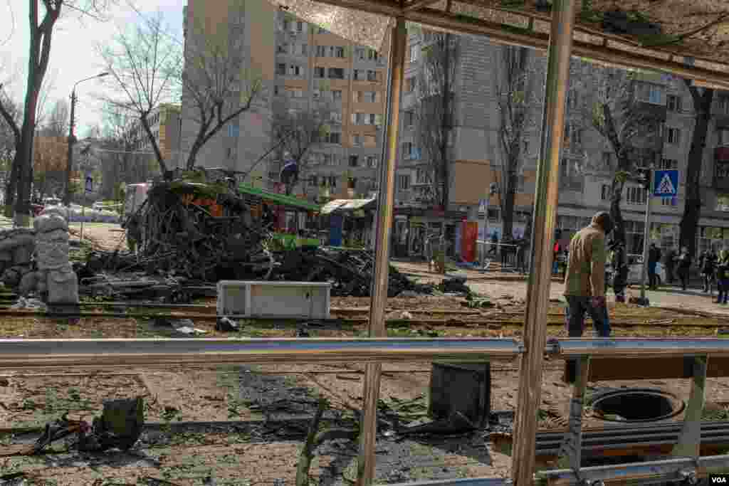 A bombed-out streetcar is seen after a missile hit this residential area in Kyiv, Ukraine, March 14, 2022. 