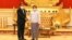 លោក ប្រាក់ សុខុន (ឆ្វេង) រដ្ឋមន្ត្រី​ការបរទេស​កម្ពុជា និង​ជា​ប្រេសិត​​របស់​ប្រធាន​អាស៊ាន ចាប់​ដៃ​គ្នា​ជាមួយ​នឹង​ប្រមុខ​រដ្ឋាភិបាល​យោធា​មីយ៉ាន់ម៉ា លោក​ឧត្តមសេនីយ៍ Min Aung Hlaing ទីក្រុង​ណៃពិដោ ប្រទេស​មីយ៉ាន់ម៉ា ថ្ងៃទី២១ ខែមីនា ឆ្នាំ២០២២។ (MYANMAR MILITARY INFORMATION TEAM / AFP) 