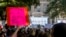 FILE - People attend the Women's March ATX rally, Oct., 2, 2021, at the Texas State Capitol in Austin, Texas. 