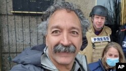 FILE - This undated image released by Fox News Channel shows cameraman Pierre Zakrzewski while on assignment with colleagues in Kyiv. Zakrzewski was killed in Ukraine on March 14, 2022.