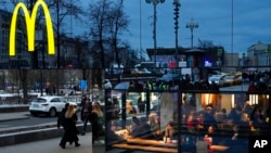 People eat in a McDonald's restaurant in the main street in Moscow, Russia, March 13, 2022. 