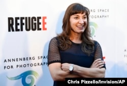 FILE - Photographer Lynsey Addario poses at the opening of the new photography exhibit "REFUGEE" at The Annenberg Space for Photography on Thursday, April 21, 2016, in Los Angeles. Addario is covering the war in Ukraine for The New York Times. (Photo by Chris Pizzello/Invision/AP)