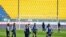 Parma's players warm up on the field moments before a Serie A soccer match between Parma and Spal was scheduled to be played, in Parma, northern Italy, March 8, 2020.