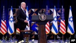 FILE - President Joe Biden walks to the podium to deliver remarks on the war between Israel and Hamas after meeting Israeli Prime Minister Benjamin Netanyahu, Wednesday, Oct. 18, 2023, in Tel Aviv. 