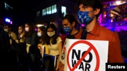 FILE - Ukrainians and Taiwanese people attend a prayer event to pray for the end of the war in Ukraine at a temple in Taipei, Taiwan, March 3, 2022.