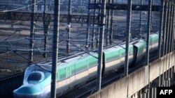 This picture shows a derailed Shinkansen bullet train in Shiroishi, Miyagi prefecture on March 17, 2022.
