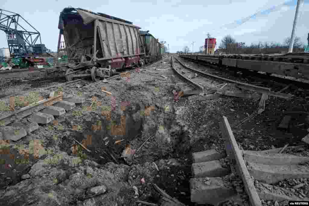 A bomb crater is seen after a Russian airstrike at a railway station in the town of Okhtyrka, in the Sumy region, March 14, 2022.