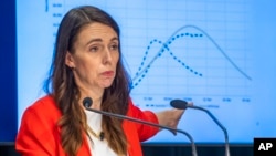 New Zealand Prime Minister Jacinda Ardern gestures during a press conference at parliament, in Wellington, New Zealand, March 23, 2022. New Zealand will remove many pandemic mandates over the next two weeks.