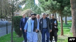 FILE - This handout photo released by the Taliban Foreign Ministry shows Taliban Foreign Minister Amir Khan Muttaqi (2L) and Kremlin's special envoy to Afghanistan, Zamir Kabulov before their meeting in Kabul, March 24, 2022. (Photo by Taliban Foreign Ministry / AFP)