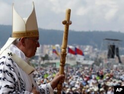 Pope Francis walks with his pastoral staff to celebrate Mass at Bicentennial Park in Quito, Ecuador, July 7, 2015.
