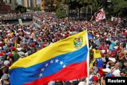 Opposition supporters take part in a rally against Venezuelan President Nicolas Maduro's government in Caracas, Venezuela, Jan. 23, 2019.