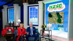 President Joe Biden and first lady Jill Biden speak with the NORAD Tracks Santa Operations Center in Colorado, and families calling into the NORAD system, via teleconference in the South Court Auditorium on the White House campus in Washington, Dec. 24, 2021.