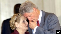 FILE - President Bill Clinton confers with US Secretary of State Madeleine Albright before delivering the final statement at the Middle East Summit in the Egyptian resort town of Sharm el-Sheik, Egypt, on Oct. 17, 2000.
