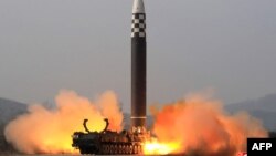 This picture released from North Korea's official Korean Central News Agency (KCNA) shows the test launch of what state media calls a new type inter-continental ballistic missile, the Hwasongpho-17 from an undisclosed location in North Korea, March 24, 2022.