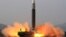 This picture released from North Korea's official Korean Central News Agency (KCNA) shows the test launch of what state media calls a new type inter-continental ballistic missile, the Hwasongpho-17 from an undisclosed location in North Korea, March 24, 2022.